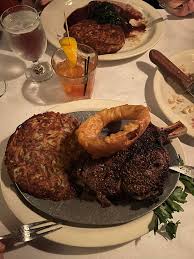 Tornado Steak House signature dishes  Various cuts of Steak (e.g., Filet Mignon, New York Strip, Ribeye), Walleye Pike, Coquilles St. Jacques, Relish Tray, classic cocktails.